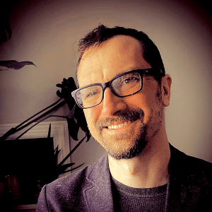 Picture of Sky Adams, man with glasses smiling